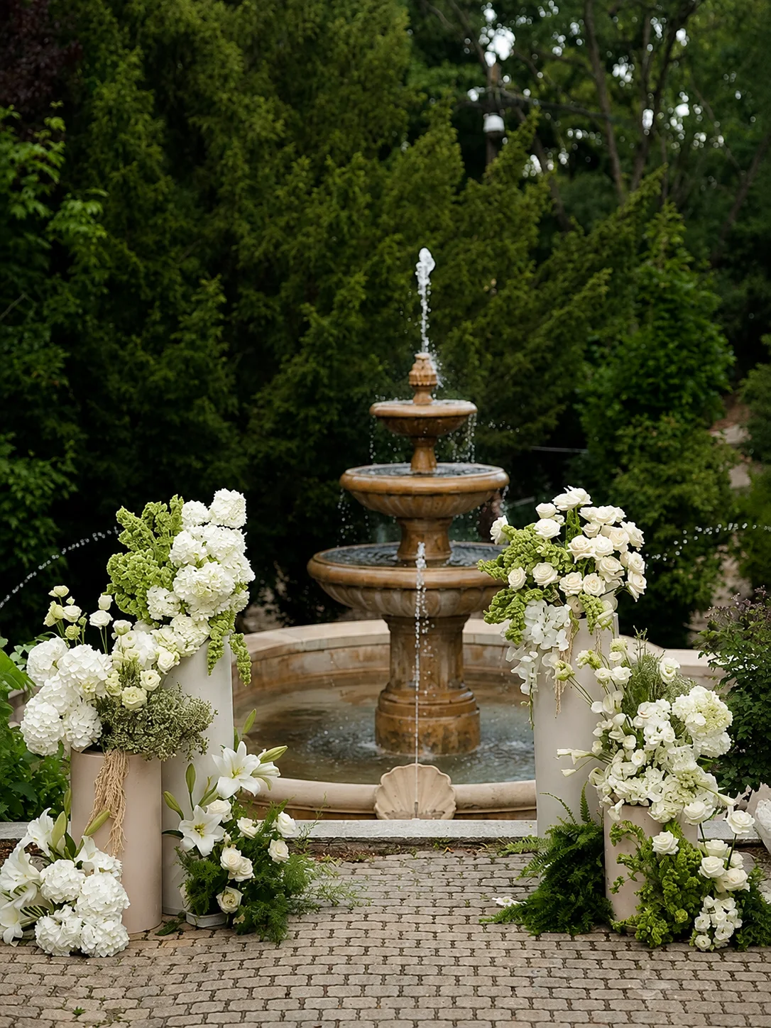 Garden fountain ceremony florals in white and green