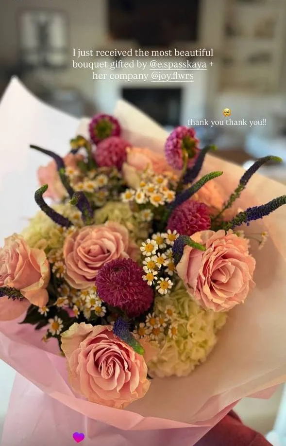 Client sharing photos of florals by Joy Flowers Studio